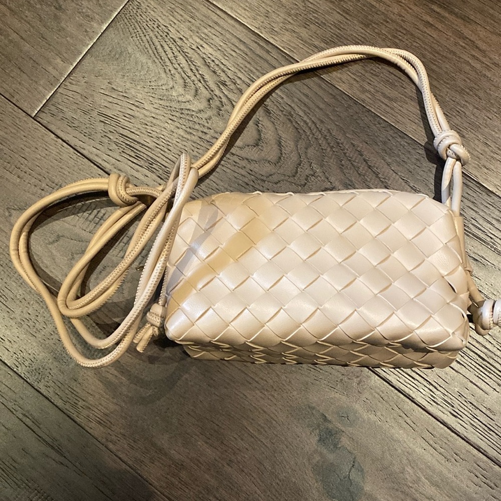 Cream coloured mini purse with a weave pattern